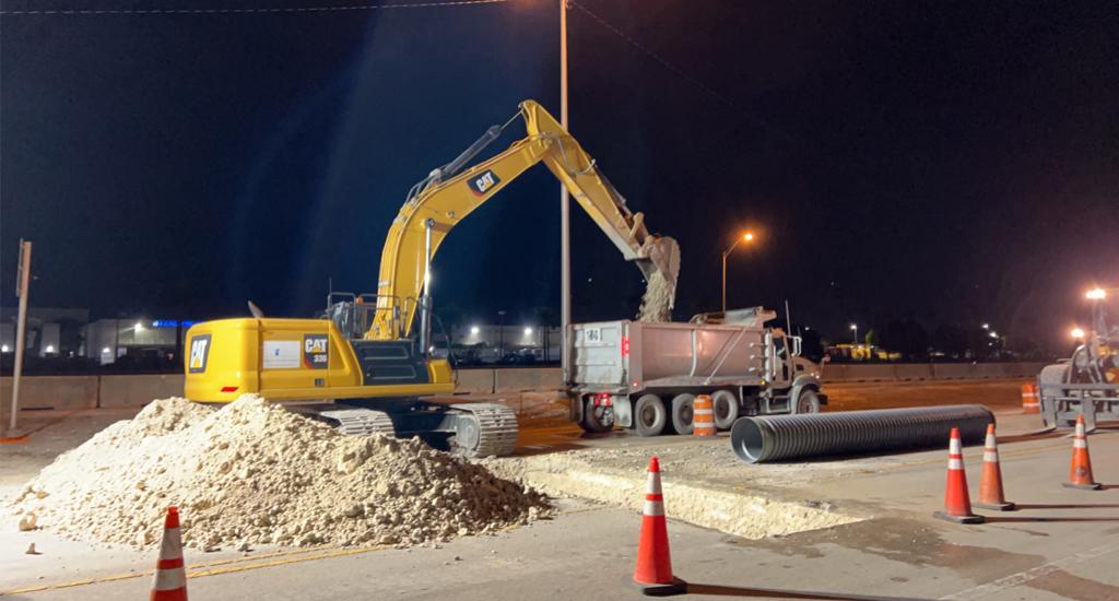 Excavator loading soil the truck